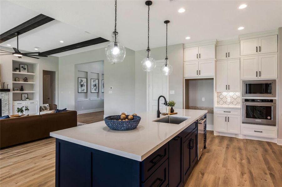 Stunning kitchen with modern fixtures, elegant cabinetry, and a spacious island, perfect for cooking and entertaining.