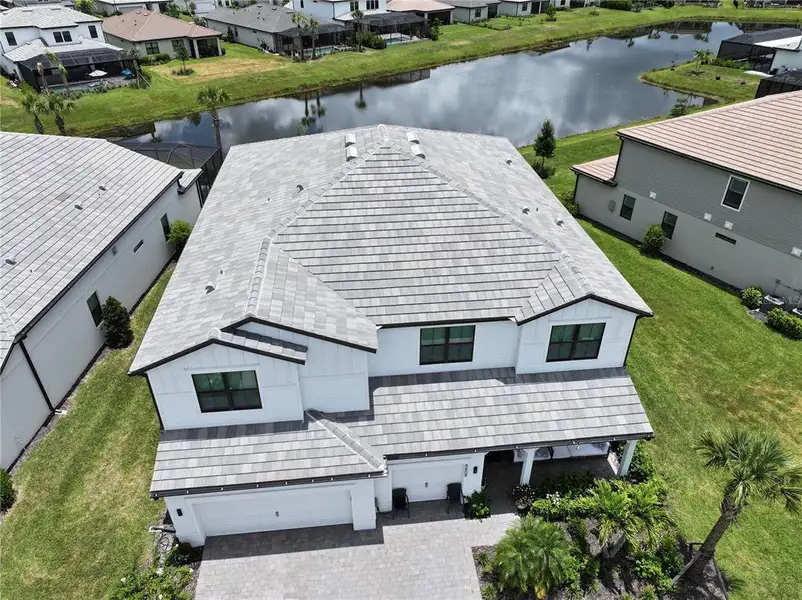 Front exterior of a new home in , Lakewood Ranch, FL, highlighting curb appeal (Image 2). Front exterior of a new home in , Lakewood Ranch, FL, highlighting curb appeal (Image 2).