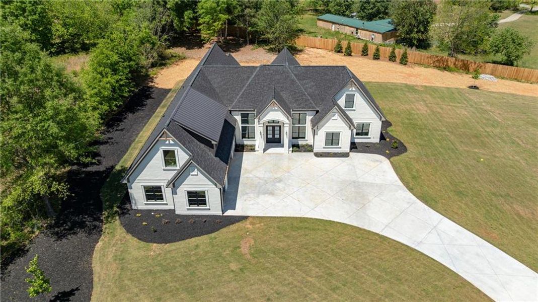 Front exterior of a new home in , Monroe, GA, highlighting curb appeal (Image 38).