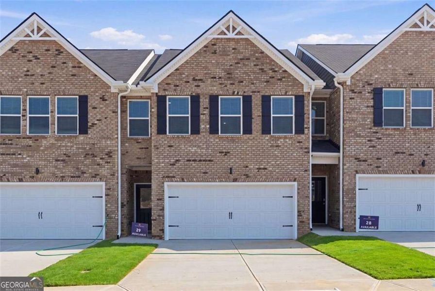 Front exterior of a new home in Parkway James, Snellville, GA, highlighting curb appeal (Image 1). Front exterior of a new home in Parkway James, Snellville, GA, highlighting curb appeal (Image 1).
