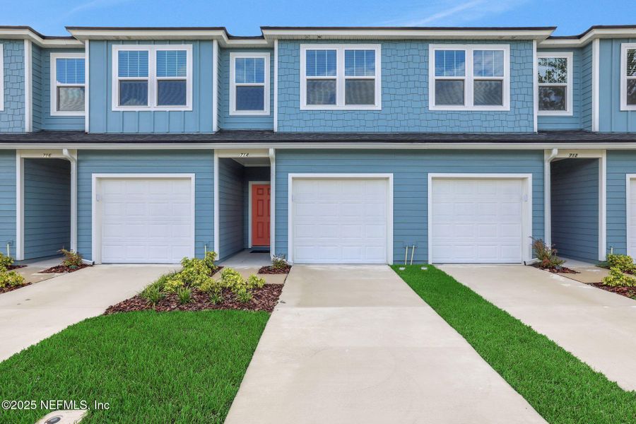 Front exterior of a new home in Kasen Oaks, Jacksonville, FL, highlighting curb appeal (Image 22).