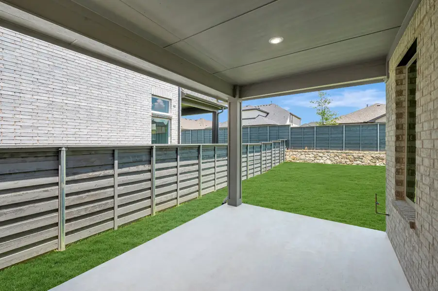 Exterior details and patio area of a home in Union Park, Little Elm (Image 3). Exterior details and patio area of a home in Union Park, Little Elm (Image 3).