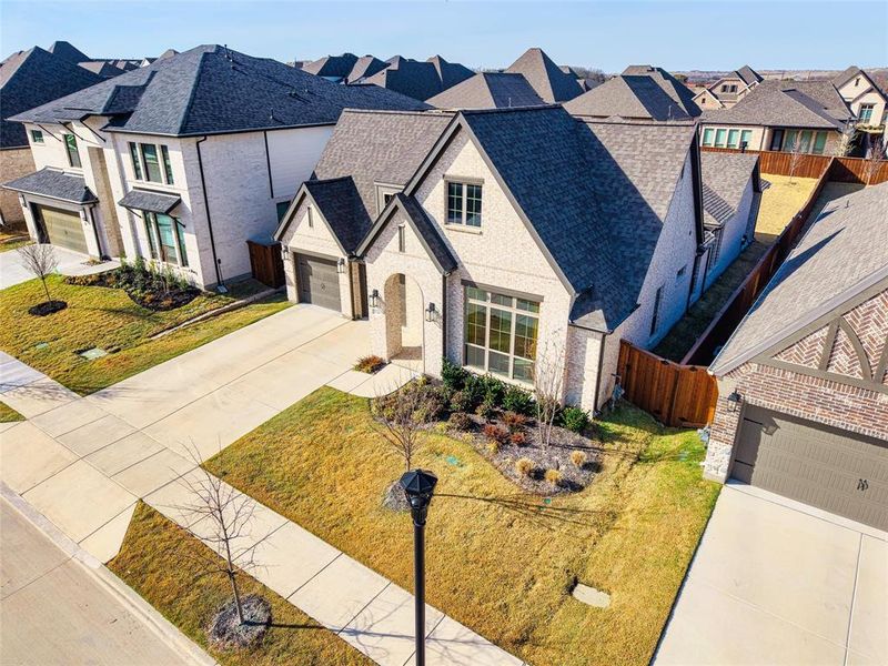 Front exterior of a new home in Walsh, Fort Worth, TX, highlighting curb appeal (Image 25).