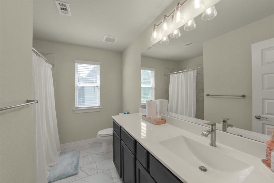Stylish secondary bathroom designed with functionality and comfort in mind.