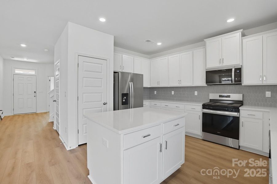 Gas range and refrigerator