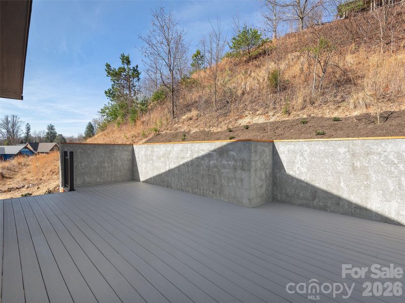 Spacious rear deck with rear access, creating a great outdoor retreat just off the primary bedroom.