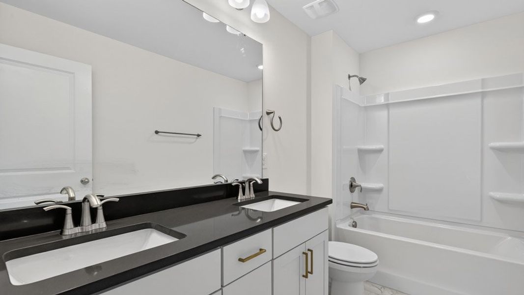 Furnished interior view inside a new home in The Estates Park, Apex (Image 10).