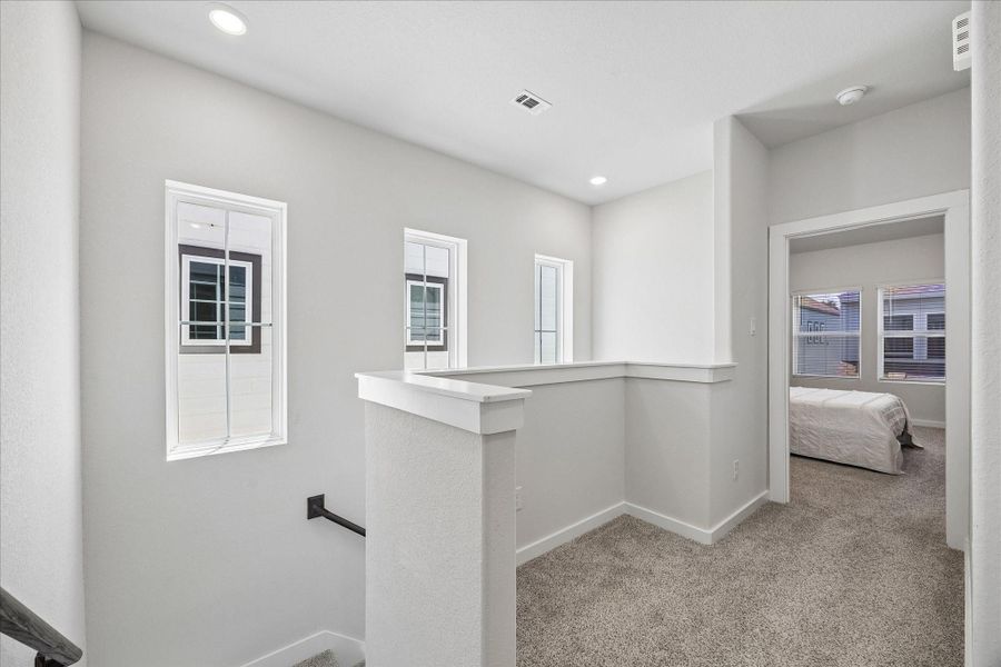 Furnished interior view inside a new home in Dunvale Village - Townhome Collection, Houston (Image 27).