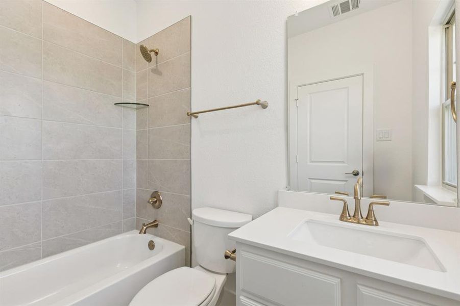 Bathroom with bathtub / shower combination and vanity
