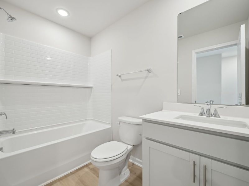 The upstairs bedroom is adjacent to the secondary bedrooms.