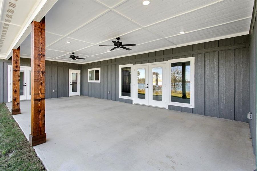 View of patio featuring french doors and ceiling fan