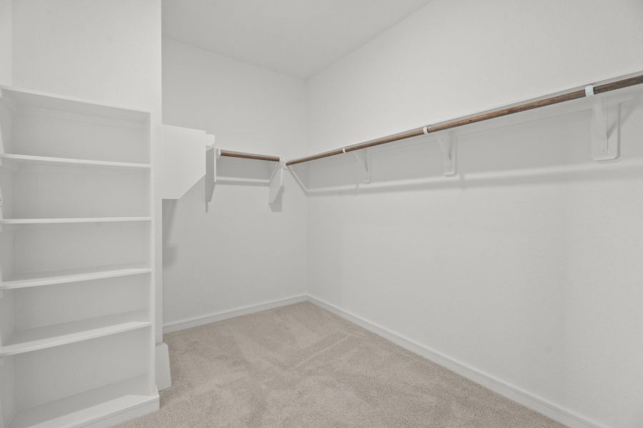 Large walk-in closet in the primary suite Large walk-in closet in the primary suite