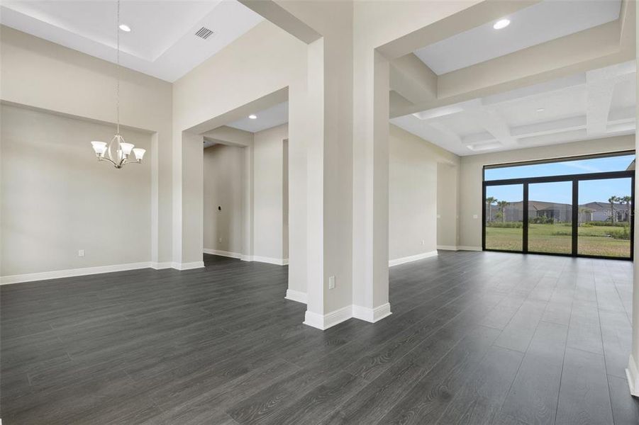 Formal dining room off to the left and formal living room. Both with soaring tray ceiling detail.