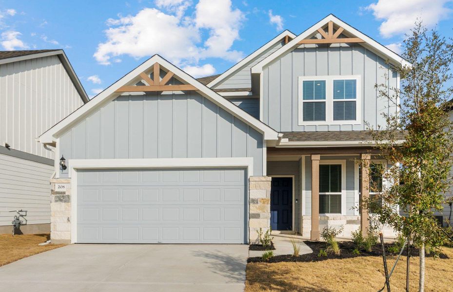Front exterior of a new home in Patterson Ranch, Georgetown, TX, highlighting curb appeal (Image 2). Front exterior of a new home in Patterson Ranch, Georgetown, TX, highlighting curb appeal (Image 2).
