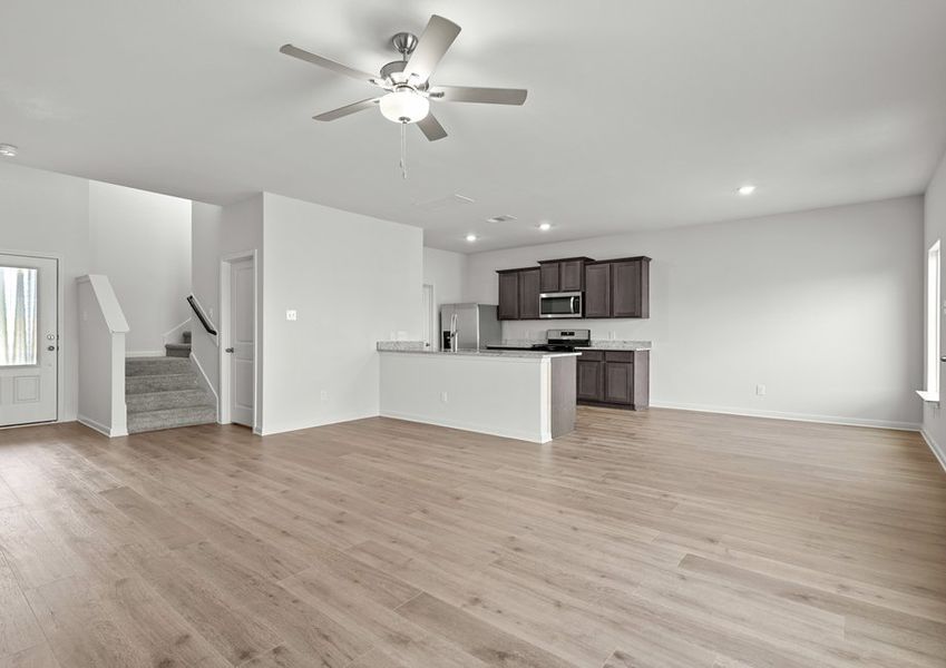 The family room sits adjacent to the kitchen and dining room. The family room sits adjacent to the kitchen and dining room.
