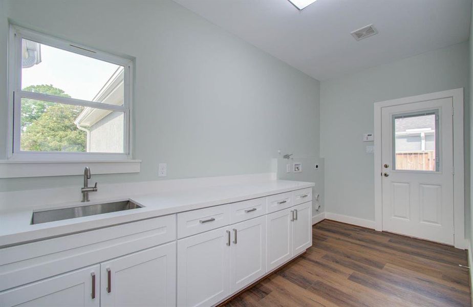 Sink and granite countertop in the Laundry area