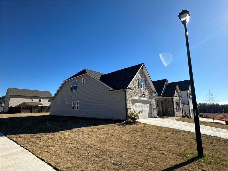 Front exterior of a new home in Summerlin, Auburn, GA, highlighting curb appeal (Image 27).