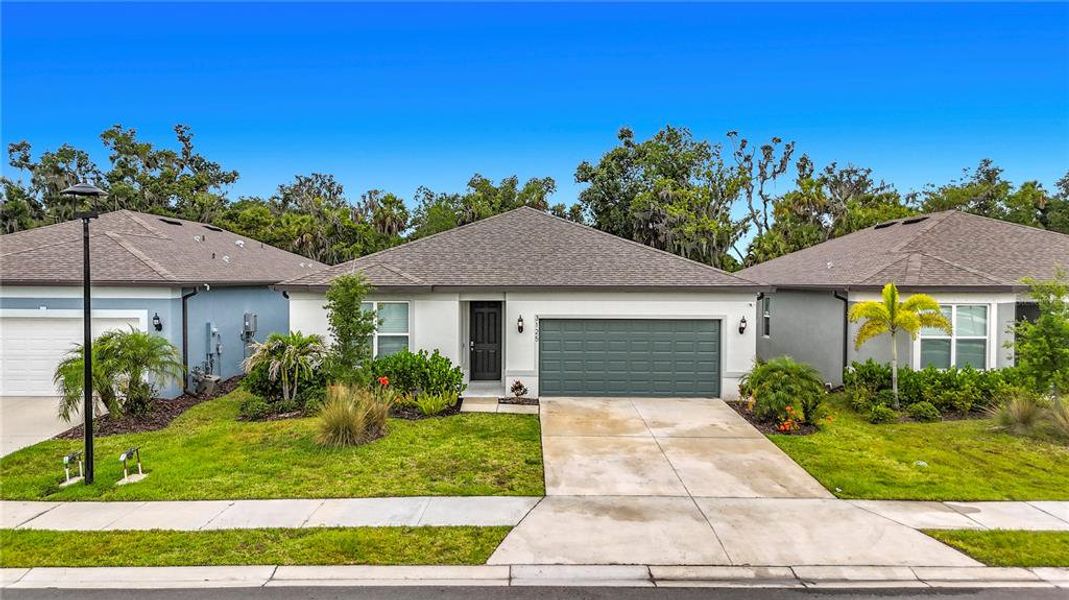 Front exterior of a new home in , Ellenton, FL, highlighting curb appeal (Image 24). Front exterior of a new home in , Ellenton, FL, highlighting curb appeal (Image 24).