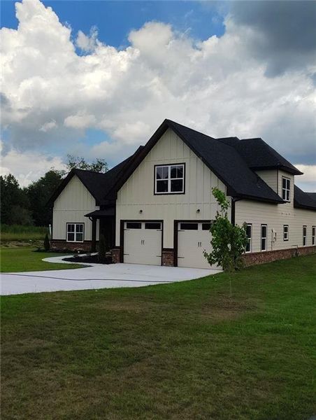 Front exterior of a new home in , Loganville, GA, highlighting curb appeal (Image 2). Front exterior of a new home in , Loganville, GA, highlighting curb appeal (Image 2).