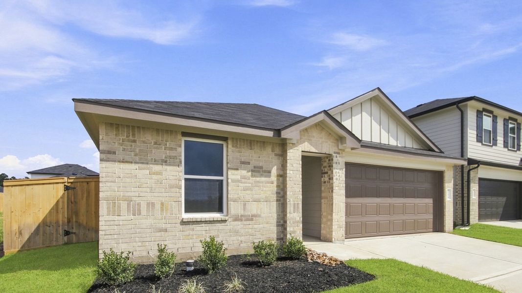 Front exterior of a new home in Mill Creek, Magnolia, TX, highlighting curb appeal (Image 18).