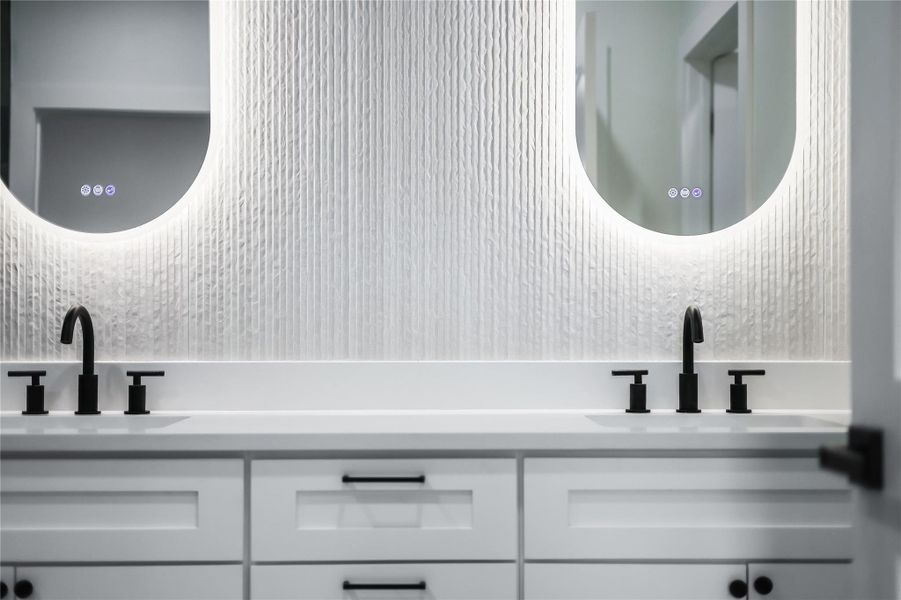 Bathroom with tasteful backsplash and double vanity Bathroom with tasteful backsplash and double vanity