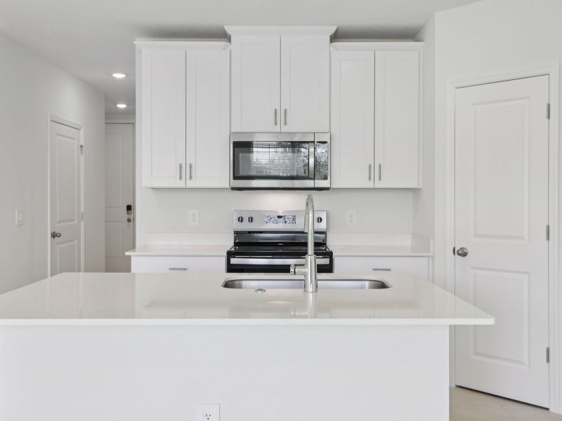 Furnished interior view inside a new home in The Reserve at Hammock Oaks Townes, Lady Lake (Image 3).