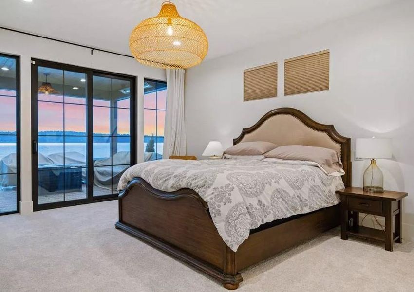 Large Primary Bedroom with a Expanisve water views with Sliding Door for access to Covered Patio