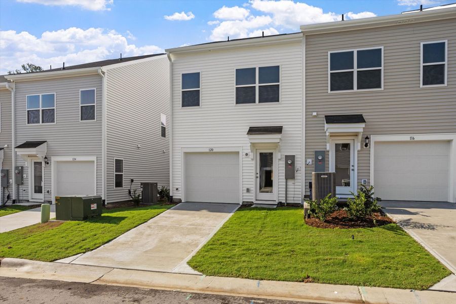 Front exterior of a new home in Renaissance at White Oak, Garner, NC, highlighting curb appeal (Image 19). Front exterior of a new home in Renaissance at White Oak, Garner, NC, highlighting curb appeal (Image 19).