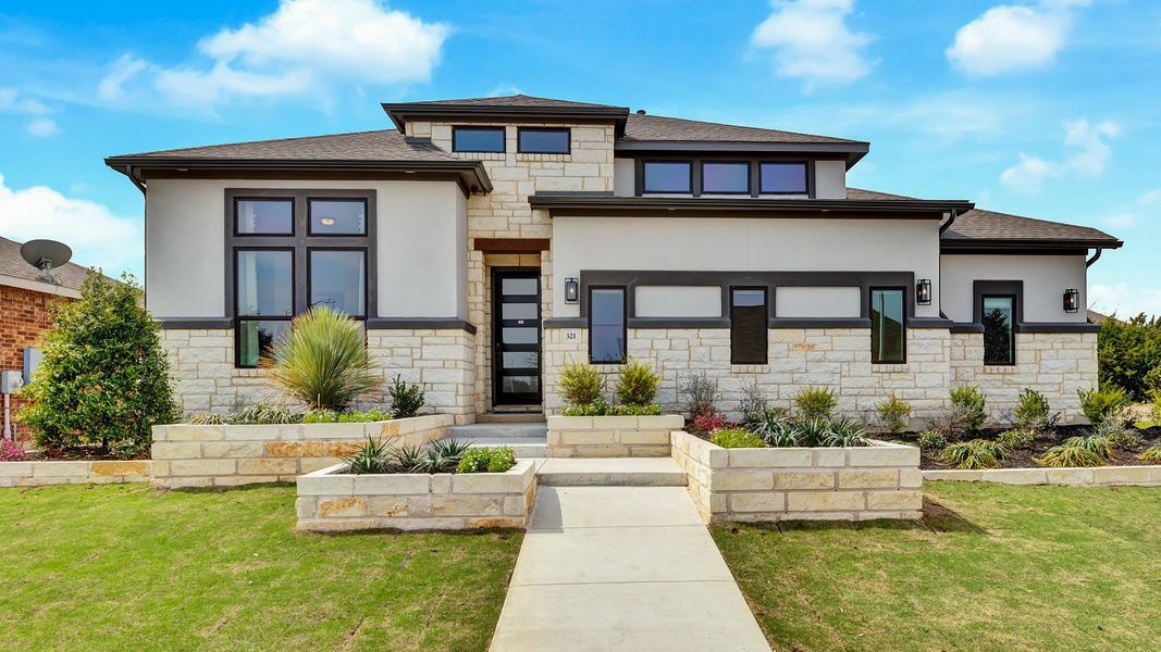 Representative exterior photo of a completed home built from the Vanderbilt by DRB Homes in Hawkes Landing, Leander, TX (Image 21). Representative exterior photo of a completed home built from the Vanderbilt by DRB Homes in Hawkes Landing, Leander, TX (Image 21).