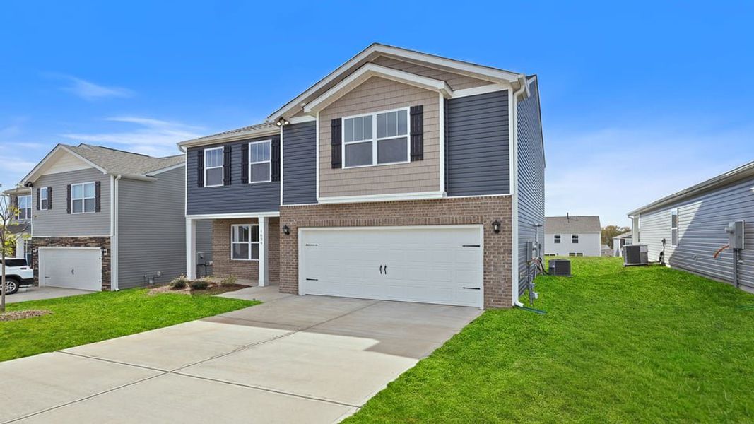 Front exterior of a new home in Sage Grove, Lyman, SC, highlighting curb appeal (Image 2). Front exterior of a new home in Sage Grove, Lyman, SC, highlighting curb appeal (Image 2).