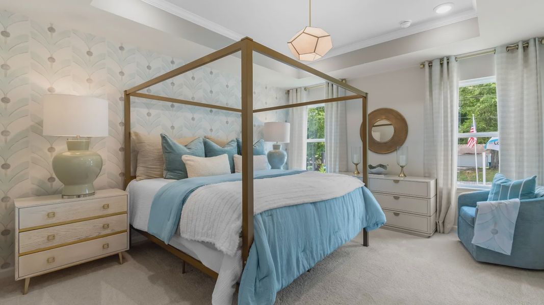 Stylish primary suite in new contruction townhome featuring soft textiles and calming neutral palette.