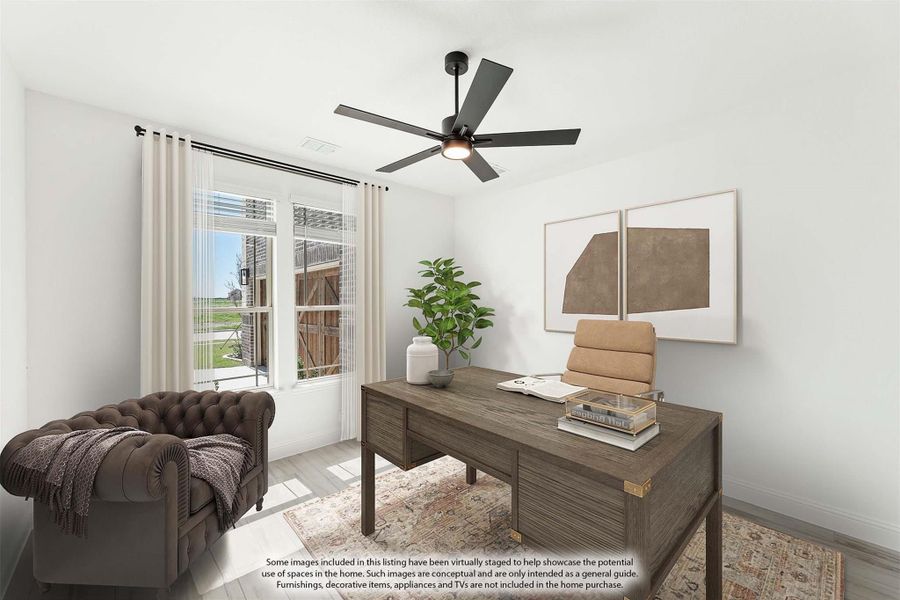 Home office with wood desk, leather chair, ceiling fan, and large window with natural light Home office with wood desk, leather chair, ceiling fan, and large window with natural light