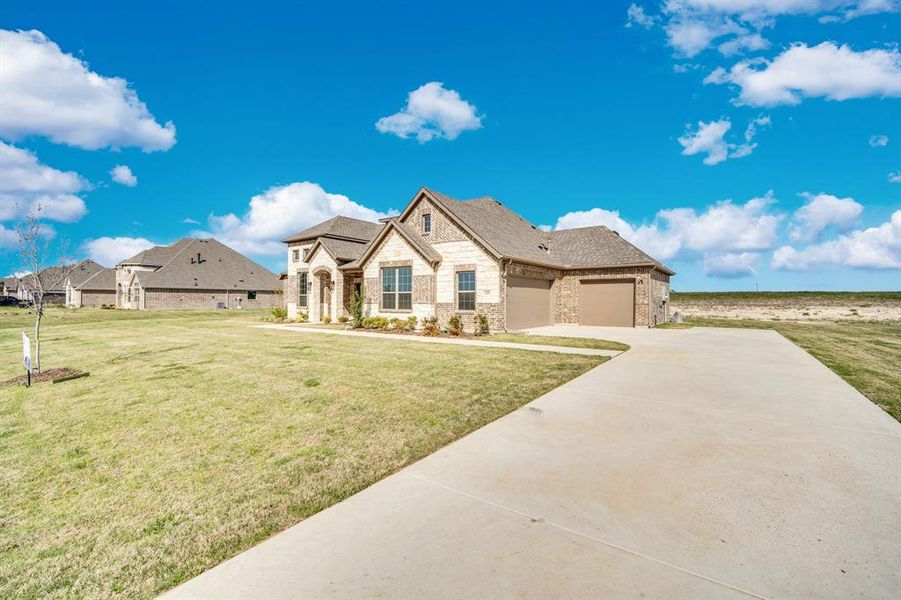 Front exterior of a home in the Levante community, located in Waxahachie, TX (Image 12).