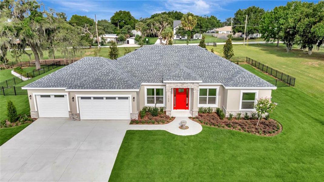 Front exterior of a new home in , Montverde, FL, highlighting curb appeal (Image 2). Front exterior of a new home in , Montverde, FL, highlighting curb appeal (Image 2).