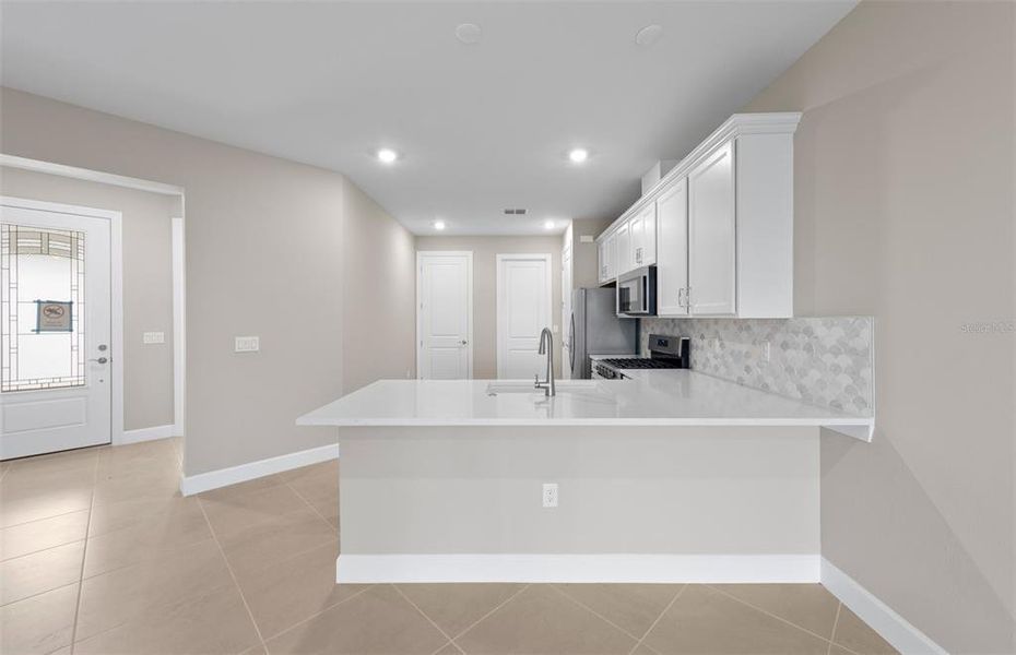Furnished interior view inside a new home in BeachWalk by Manasota Key, Englewood (Image 7).