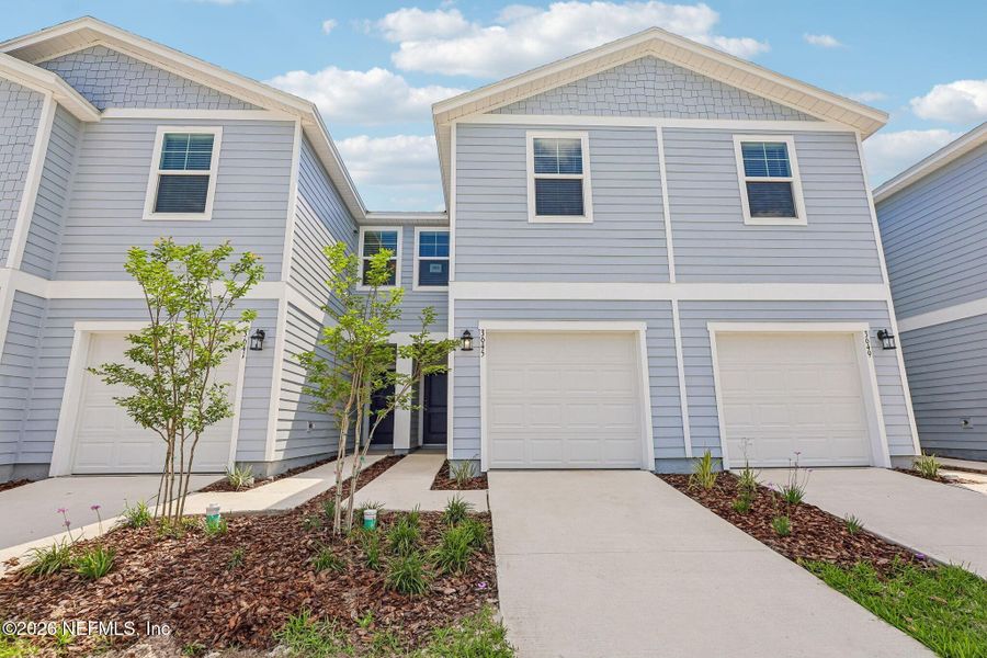 Front exterior of a new home in , Middleburg, FL, highlighting curb appeal (Image 22).