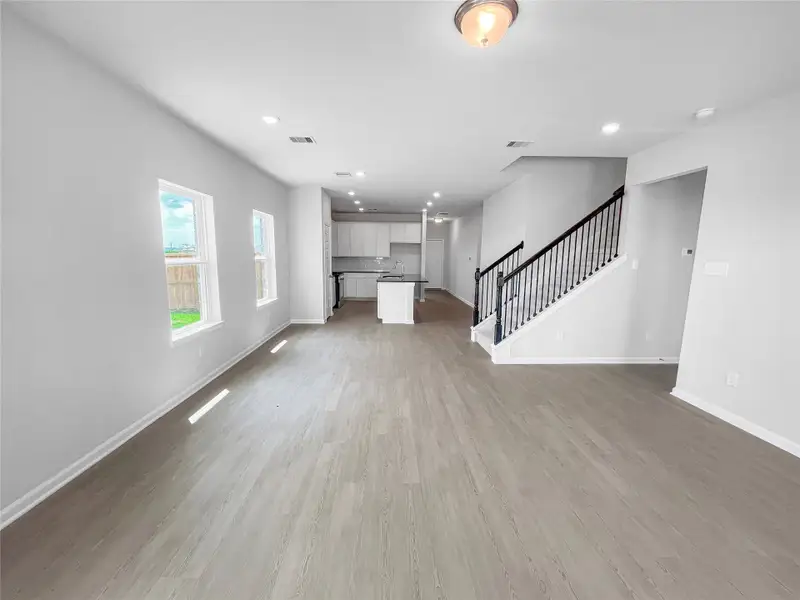 The Waring III- Family Room into Dining Area and Kitchen. Sample image for illustration; upgrades, options, and colors may vary. The Waring III- Family Room into Dining Area and Kitchen. Sample image for illustration; upgrades, options, and colors may vary.