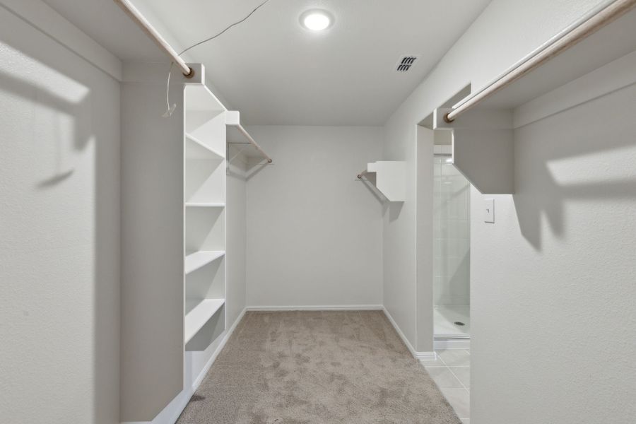 Primary Closet in the Harrison home plan by Trophy Signature Homes – REPRESENTATIVE PHOTO Primary Closet in the Harrison home plan by Trophy Signature Homes – REPRESENTATIVE PHOTO