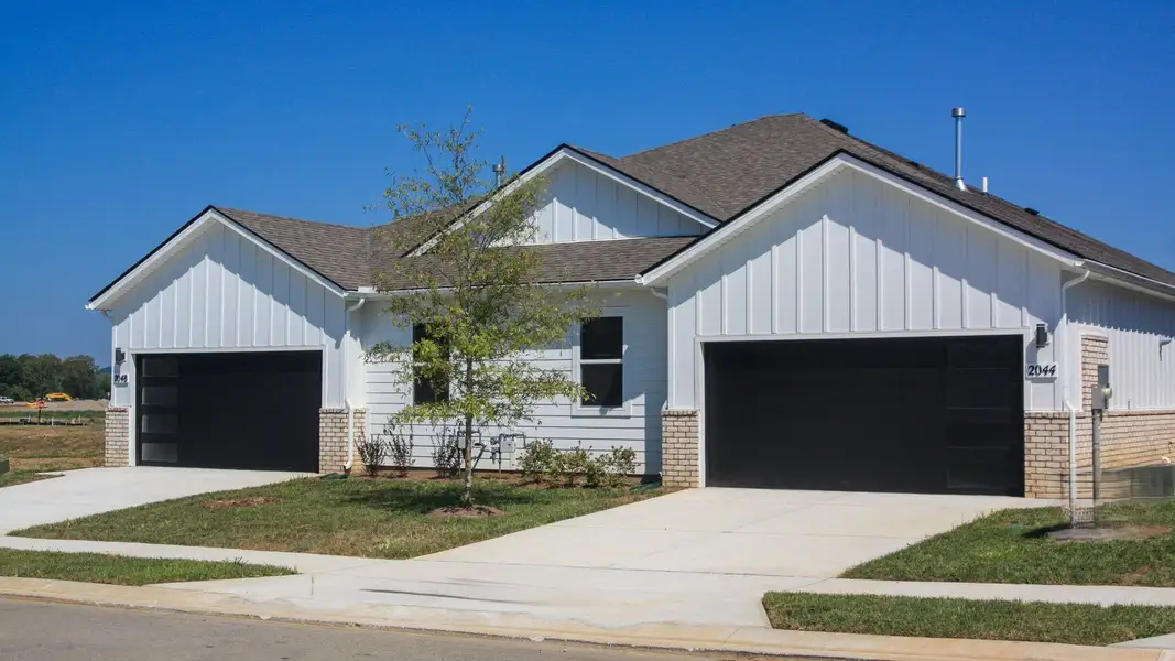 Front exterior of a new home in Nexus South, Gallatin, TN, highlighting curb appeal (Image 21).