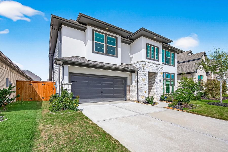 Front exterior of a new home in , Cypress, TX, highlighting curb appeal (Image 2). Front exterior of a new home in , Cypress, TX, highlighting curb appeal (Image 2).