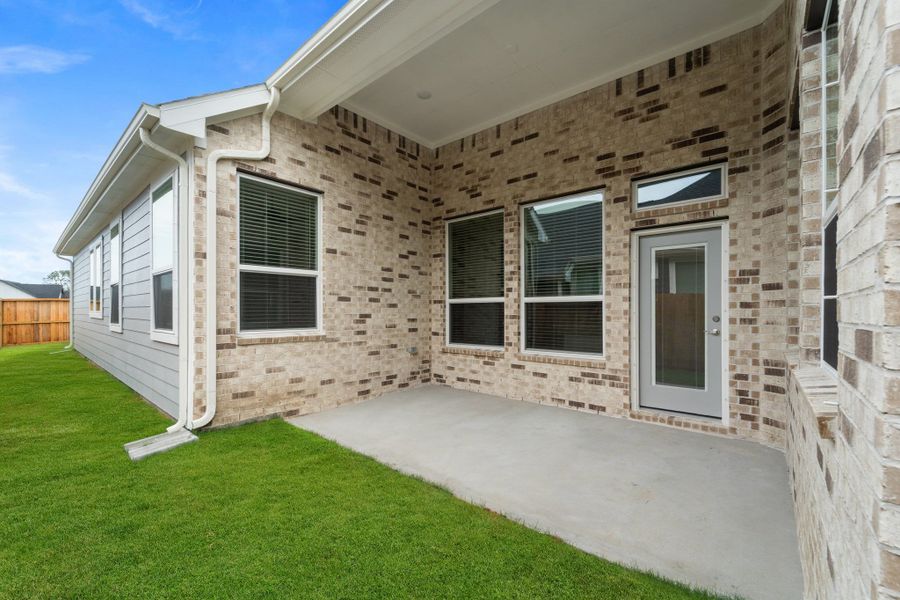 Front exterior of a new home in Riceland, Mont Belvieu, TX, highlighting curb appeal (Image 23). Front exterior of a new home in Riceland, Mont Belvieu, TX, highlighting curb appeal (Image 23).