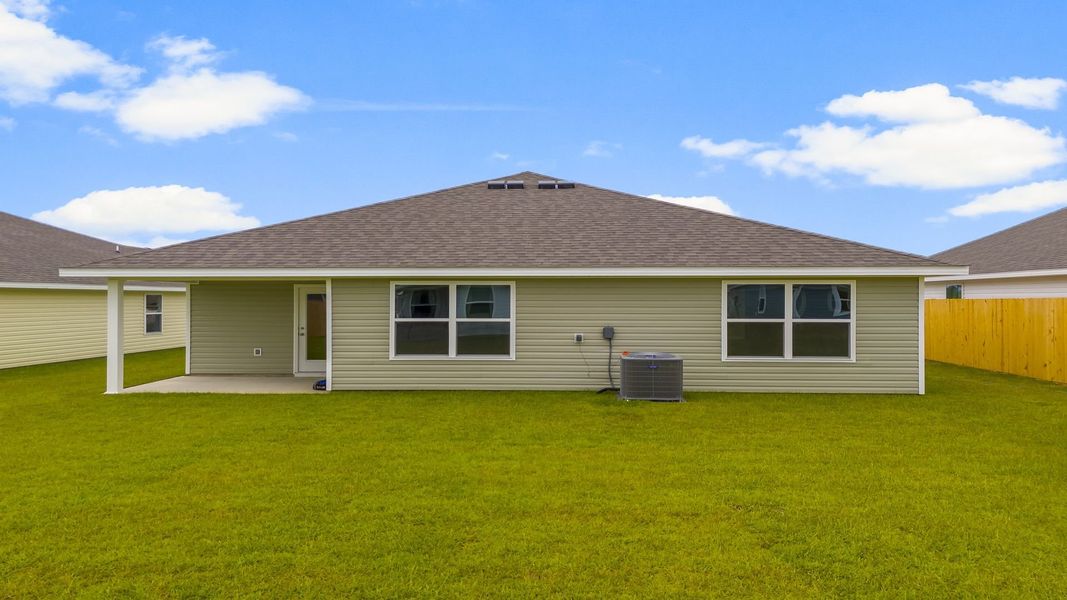 Front exterior of a new home in Park Place, Panama City, FL, highlighting curb appeal (Image 20). Front exterior of a new home in Park Place, Panama City, FL, highlighting curb appeal (Image 20).