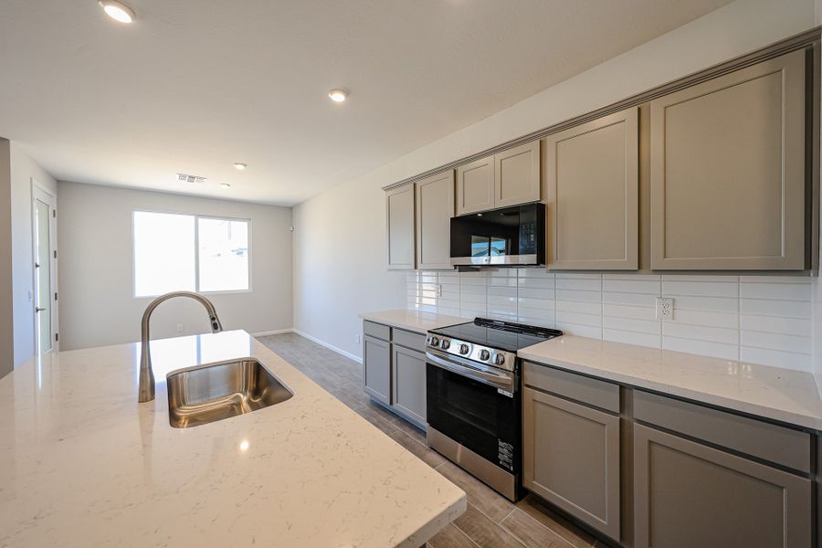 A kitchen with white cabinets. A kitchen with white cabinets.
