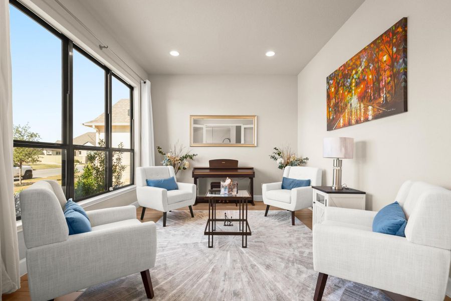 Living area with recessed lighting and wood finished floors Living area with recessed lighting and wood finished floors