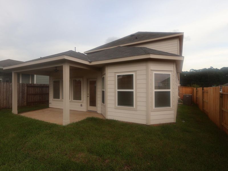 Front exterior of a new home in Lone Star Landing, Montgomery, TX, highlighting curb appeal (Image 18). Front exterior of a new home in Lone Star Landing, Montgomery, TX, highlighting curb appeal (Image 18).