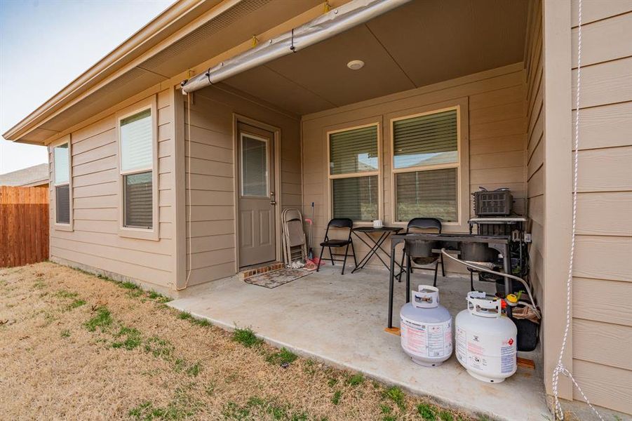 View of patio with fence