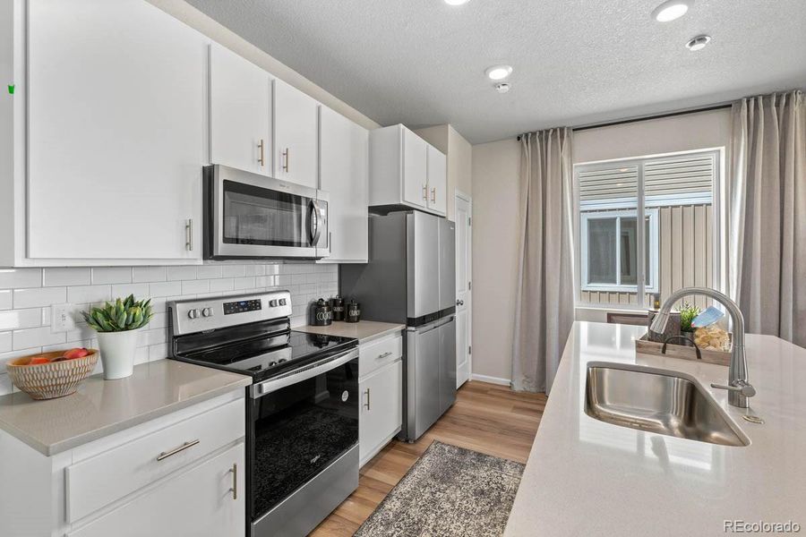 Furnished interior view inside a new home in Green Valley Ranch, Aurora (Image 8).