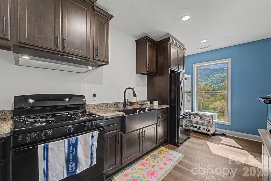 Furnished interior view inside a new home in , Waynesville (Image 17).