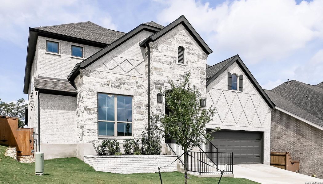 Front exterior of a new home in Johnson Ranch, Bulverde, TX, highlighting curb appeal (Image 22).