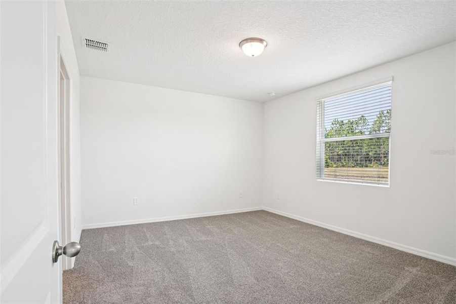 Spacious, unfurnished interior of a new home in Ridgehaven - Villas, Ormond Beach (Image 30).